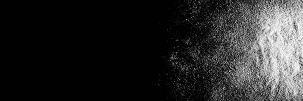 istock snow  on the black paper backgrounds 1285917934