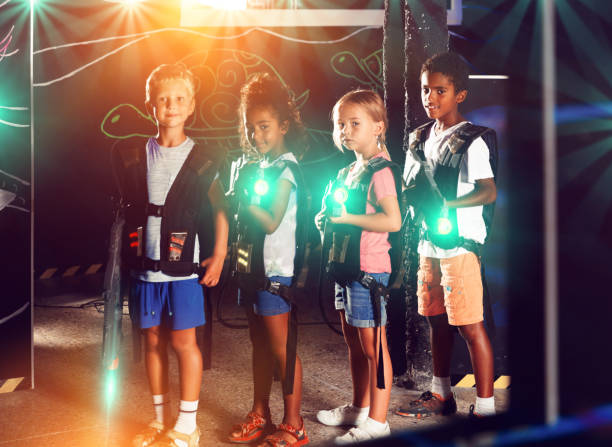 istock Multiracial kids posing on lasertag arena 1285919296