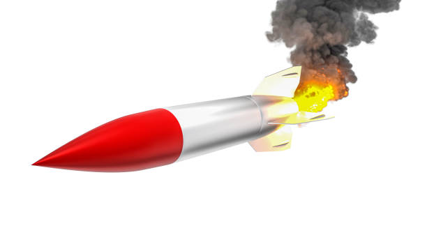 istock classic red-tipped white rocket flies with flames and smoke. 1285921559