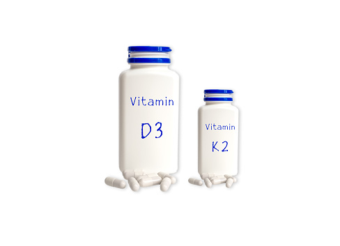 Vitamin jars isolated on white background