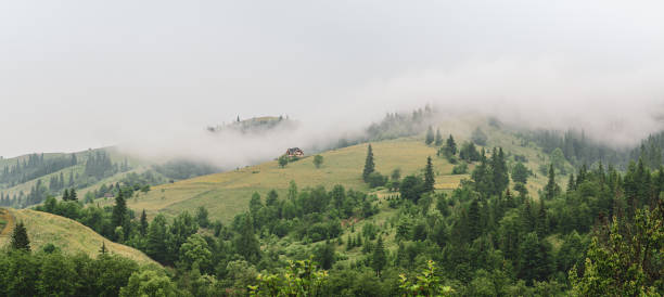 istock Little house on a green mountain slope 1285924849