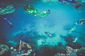 plastic waste, bottle bags floating underwater in the sea.