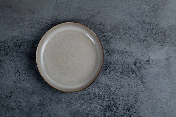 istock Vintage Rustic Plate on beautiful Stone textured background. Minimalist Style. Template for Poster Banner Cooking Baking Workshop Course 1285929166