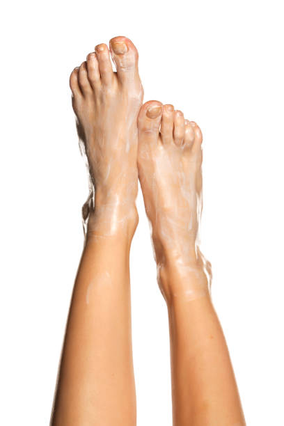 istock Female feet with foot mask 1285929465