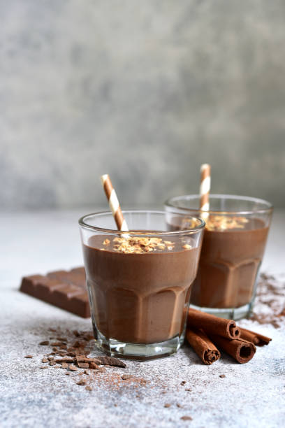 istock Chocolate banana smoothie with cinnamon and granola 1285929590