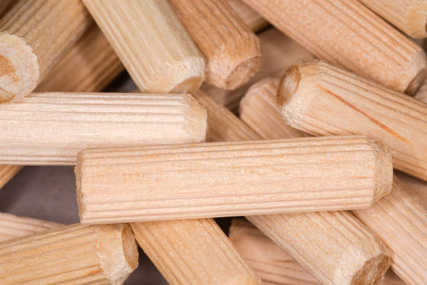 istock Wooden dowel pins close-up in selective focus 1285929917