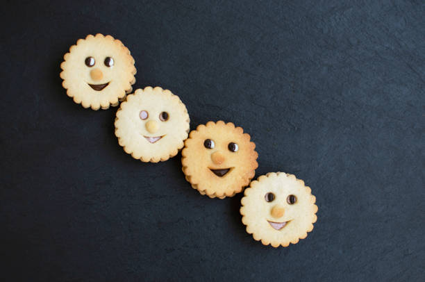 Round biscuit with smile image top view isolated on white background.
