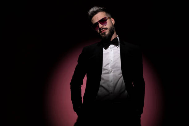 istock handsome businessman is posing with his hands in his pockets 1285930823