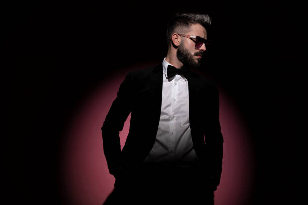 istock handsome businessman wearing sunglasses and a nice tuxedo 1285930839