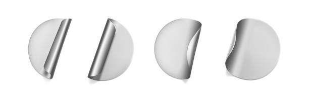 istock Silver round crumpled stickers with peeling corner mock up set. Adhesive silver foil or plastic sticker label with wrinkled effect on white background. Blank template label tags. 3d realistic vector 1285931148