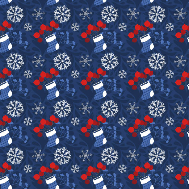 istock Knitted boots, with berries, branches and snowflakes, blue. 1285932037