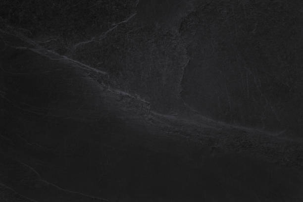 istock Dark grey black slate texture in natural pattern with high resolution for background and design art work. Black stone wall. 1285936853