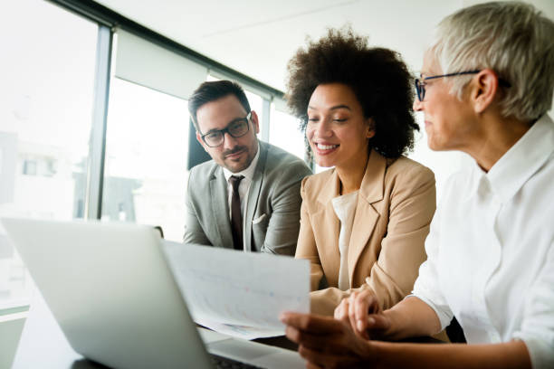 istock Group of business people working together, brainstorming in office 1285937634