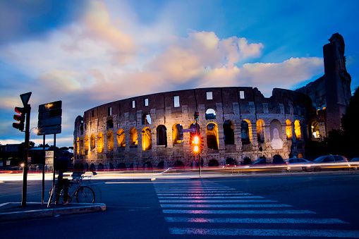 Colosseum in the night at Rome, Italy  as long exposureof car which architecture and landmark. Rome Colosseum is one of the main attractions of Rome in Italy