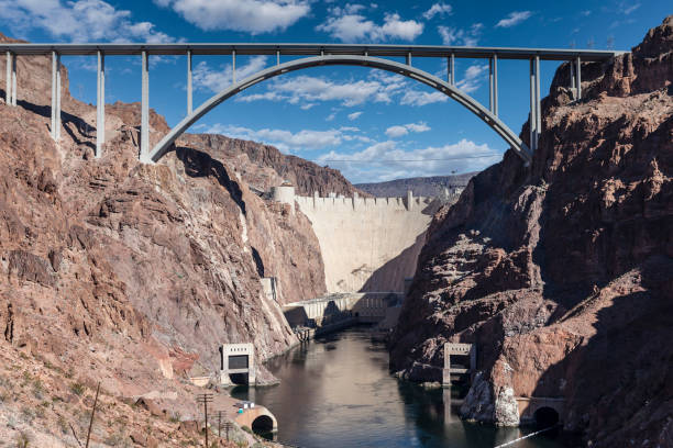 Hoover Dam bypass bridge desert canyon view with cloudy sky.