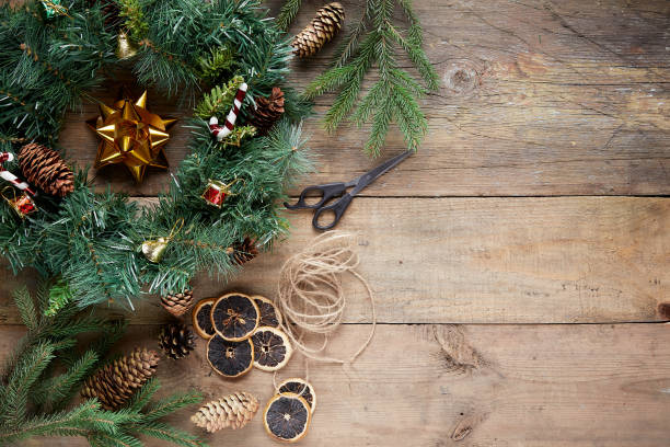 istock Christmas wreath on wooden background 1285940788