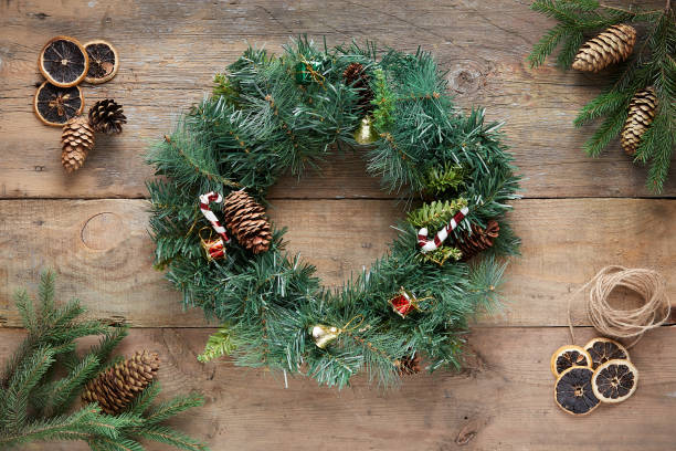 istock Christmas wreath on wooden background 1285940845