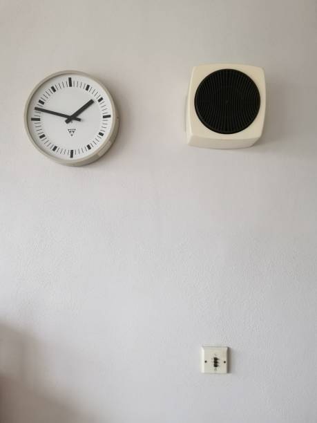 istock Electric clock and radio on the wall. 1285942126