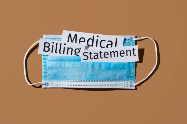 istock surgical mask and text medical billing statement 1285942315