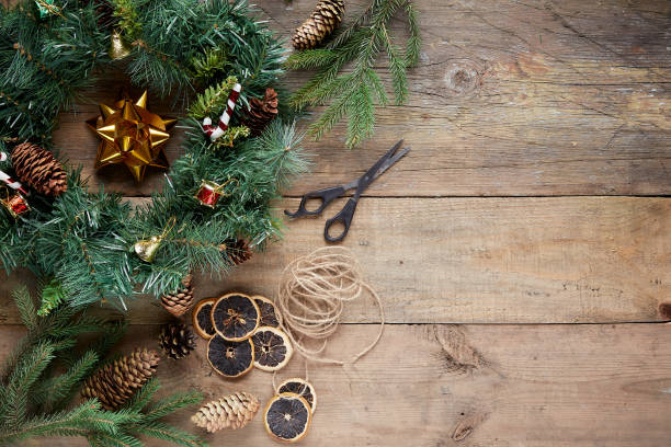 istock Christmas wreath on wooden background 1285942698