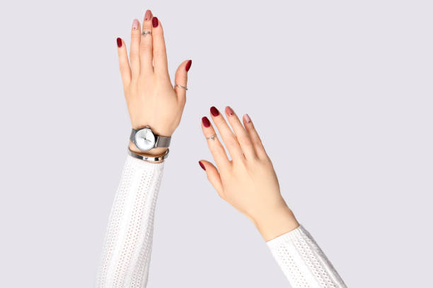 istock Beautiful womans hand with a pink manicure in minimal style 1285943838