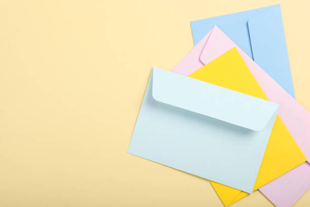 istock Paper color envelope for letters on a colored background in the air 1285943897