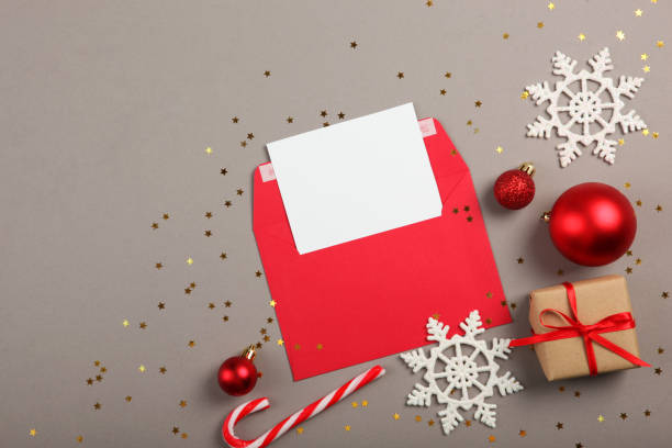 istock Paper envelope and Christmas accessories on a colored background 1285944047