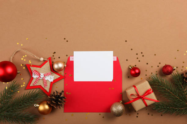 istock Paper envelope and Christmas accessories on a colored background 1285944235