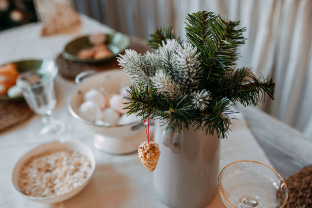 istock Christmas decorations. Fir branches with snow inside the vase on the christmas table. Decoration of festive table for christmas eve. Festive dish for new year eve. 1285945062