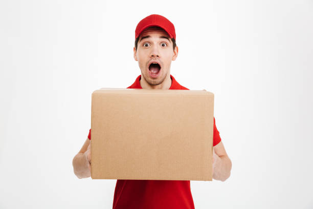 istock Shocked excited delivery man 1285946357