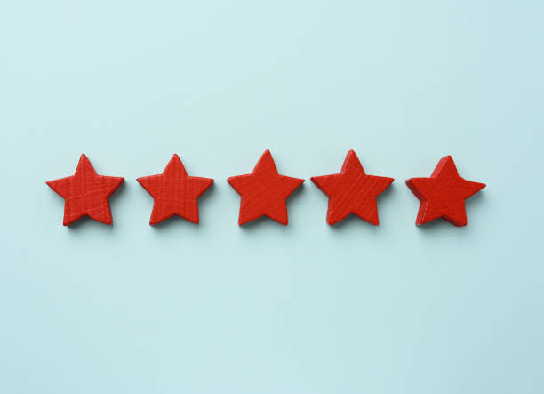 istock five red wooden stars on a blue background, high score 1285946914