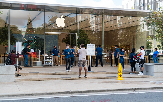 Austin , Texas , USA - November 5th , 2020: people start to wait in long lines for the new Apple Iphone at the Domain in Austin Texas