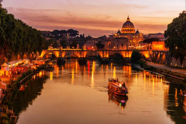 Photo of The Tiber River and St. Peters Basilica in Rome