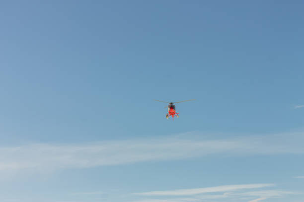 istock Red rescue helicopter fly in snowy mountains 1285952891