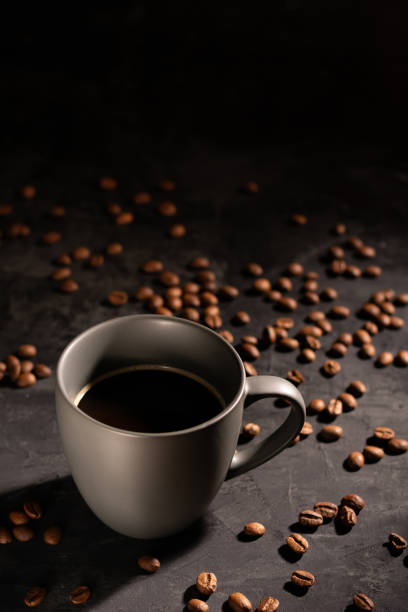istock Americano in a gray mug, vertical orientation, low key 1285953395