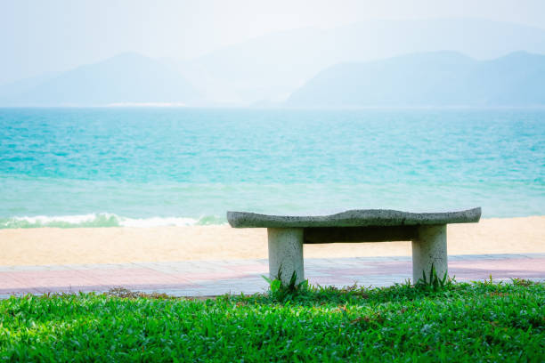 istock Free bench by the sea. 1285955314