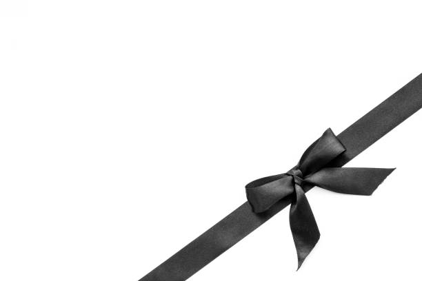 istock Black ribbon with bow isolated on white. Top view, copy space 1285955911
