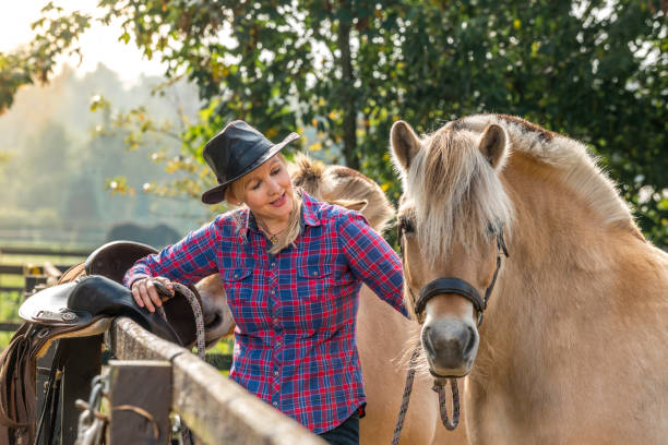 istock Woman and her horses 1285956014