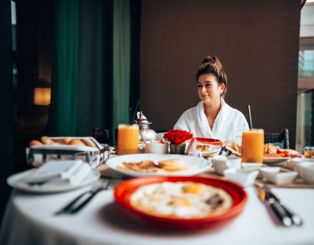 istock woman at the table for the buffet breakfast with fruit 1285956905