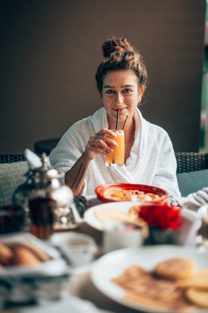 istock woman at the table for the buffet breakfast with fruit 1285957015