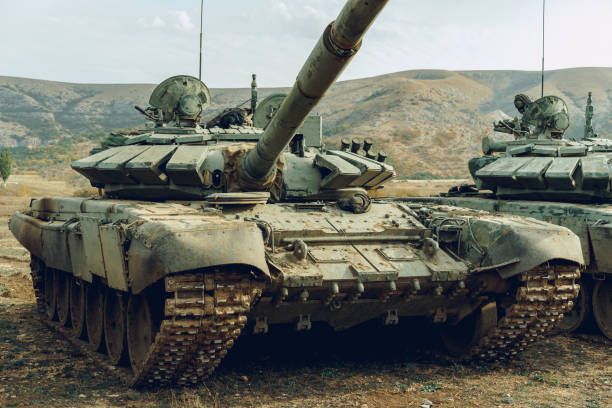 istock Russian battle tanks at tankodrome in mountains 1285958081