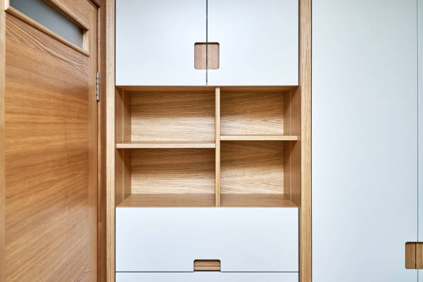 istock Modern wardrobe with finger pull design. Wooden wardrobe with light gray cabinet doors. Modern furniture 1285958194