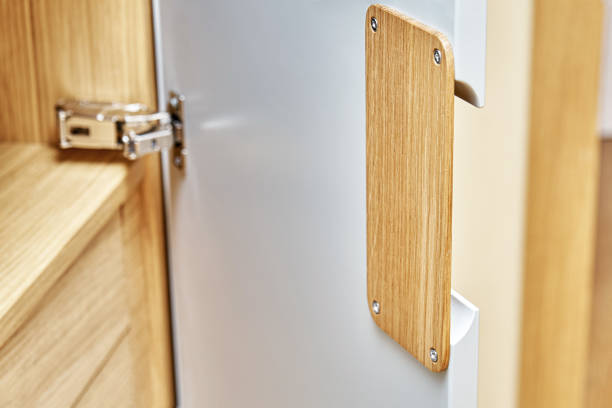 istock Modern wardrobe with finger pull design. Wooden wardrobe with light gray cabinet doors. Modern furniture 1285958281