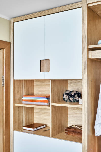 istock Modern wardrobe with finger pull design. Wooden wardrobe with light gray cabinet doors. Modern furniture 1285958355