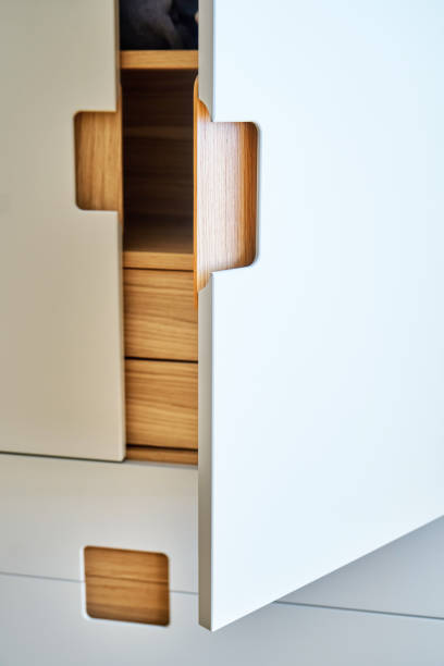 istock Modern wardrobe with finger pull design. Wooden wardrobe with light gray cabinet doors. Modern furniture 1285958564