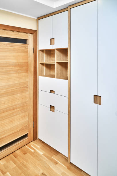 istock Modern wardrobe with finger pull design. Wooden wardrobe with light gray cabinet doors. Modern furniture 1285958754