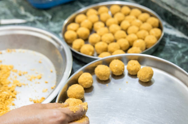 istock besan laddoos are being made for festivals in india 1285959510