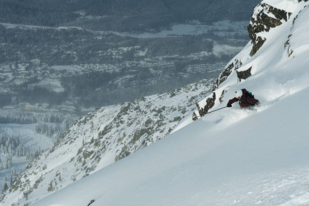 istock Woman skiing fresh powder on a ski vacation 1285960369