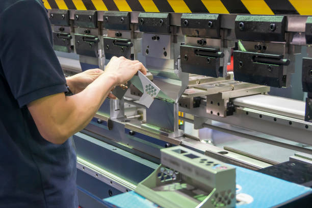 istock The operation of hydraulic bending machine with technician. 1285960528