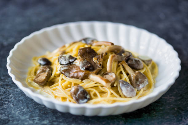istock rustic italian spaghetti pasta in mushroom cream sauce 1285960675